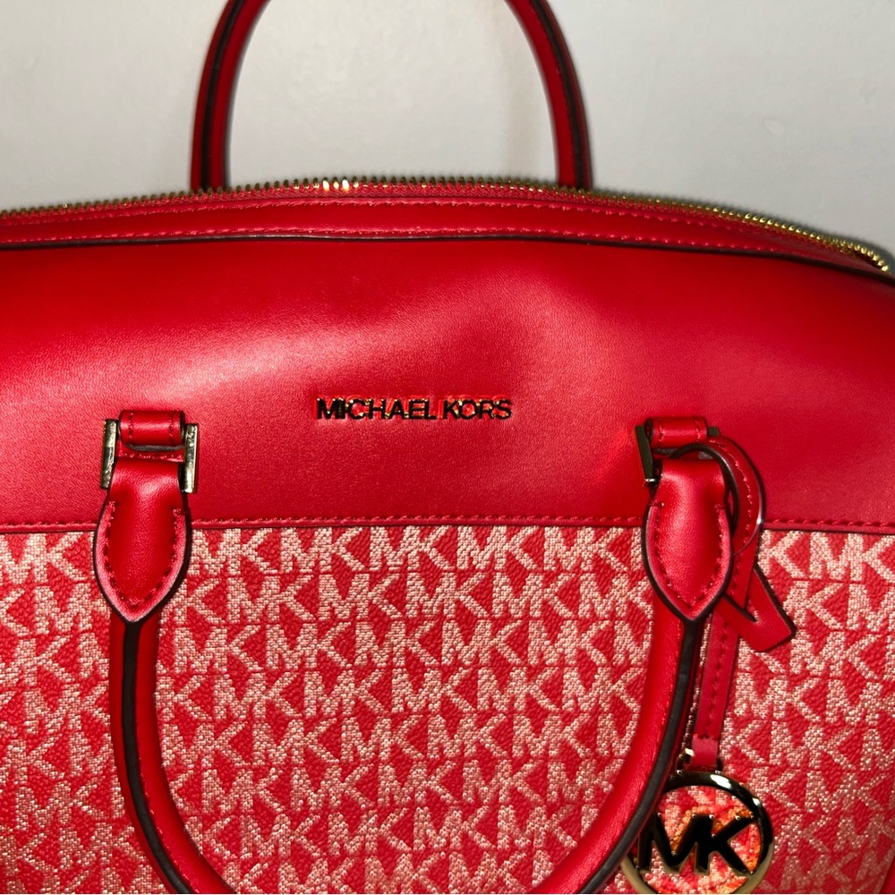 Large Red MK Purse with gold logo and longer strap in satchel shape.